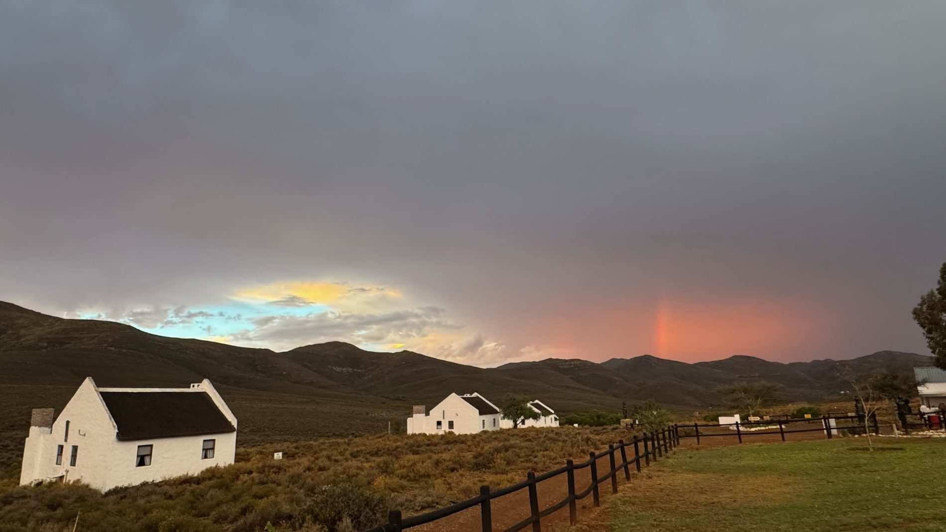 Storm clouds over Karoo chalets